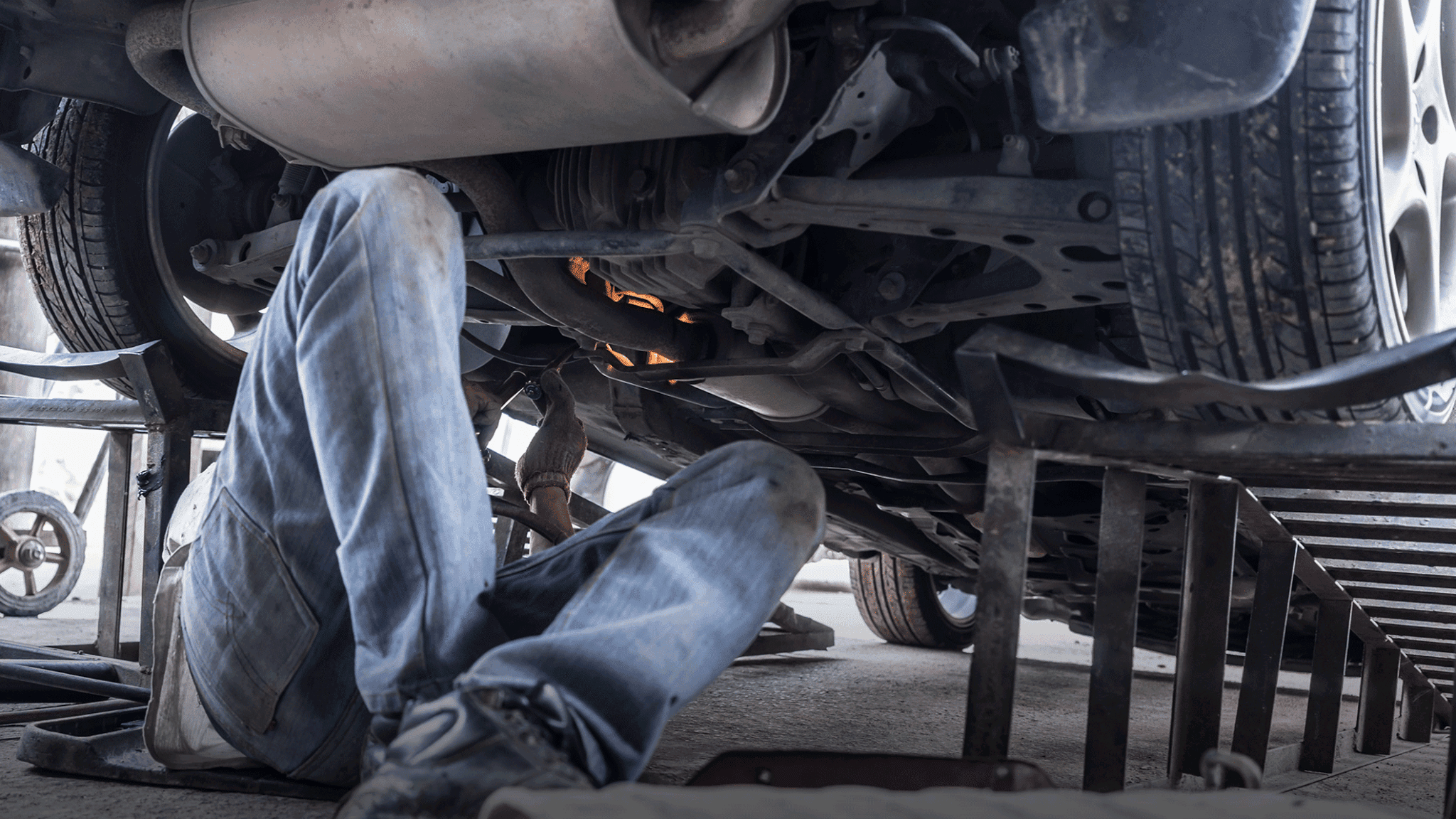 Mechanic working under a vehicle