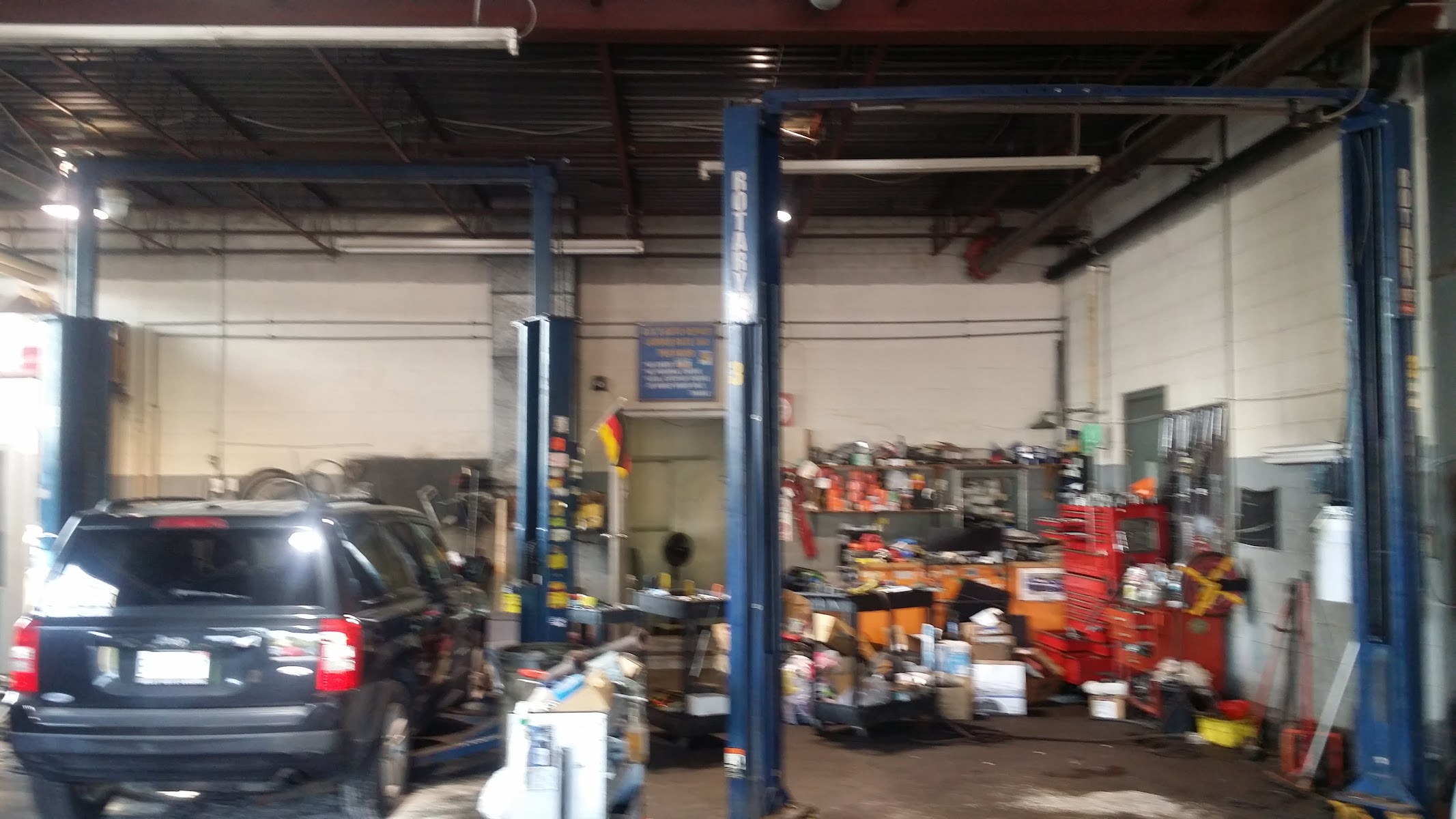 Service bay interior with two-post lifts